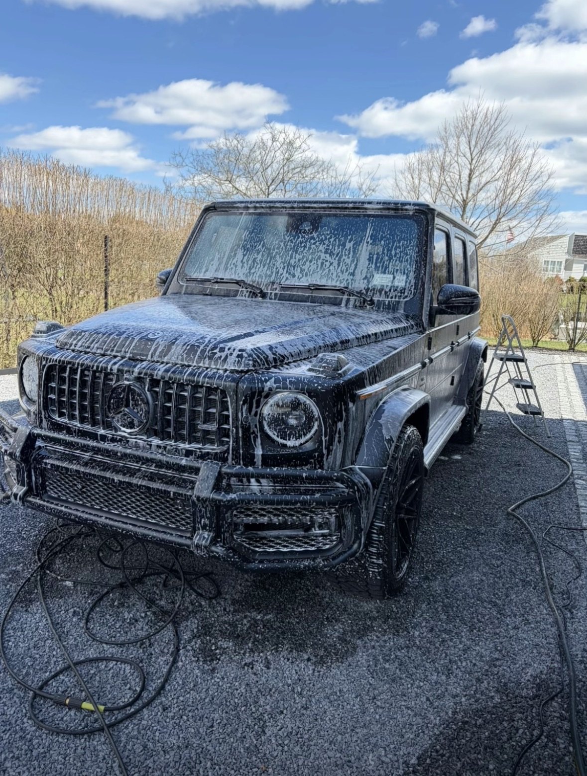 Mercedes-AMG G-Class covered in snow foam during a mobile exterior detail at an Austin home